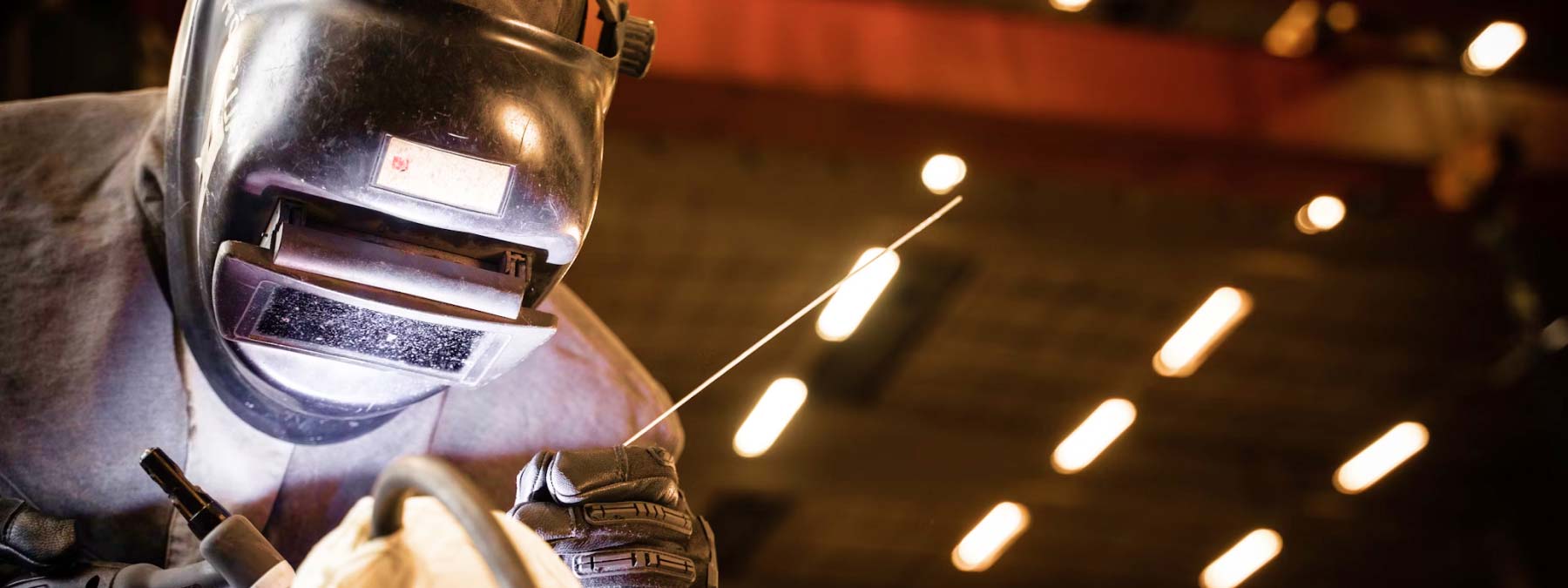 Man Wearing Welding Helmet